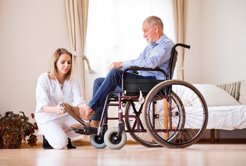 an elderly senior man getting help from in home care