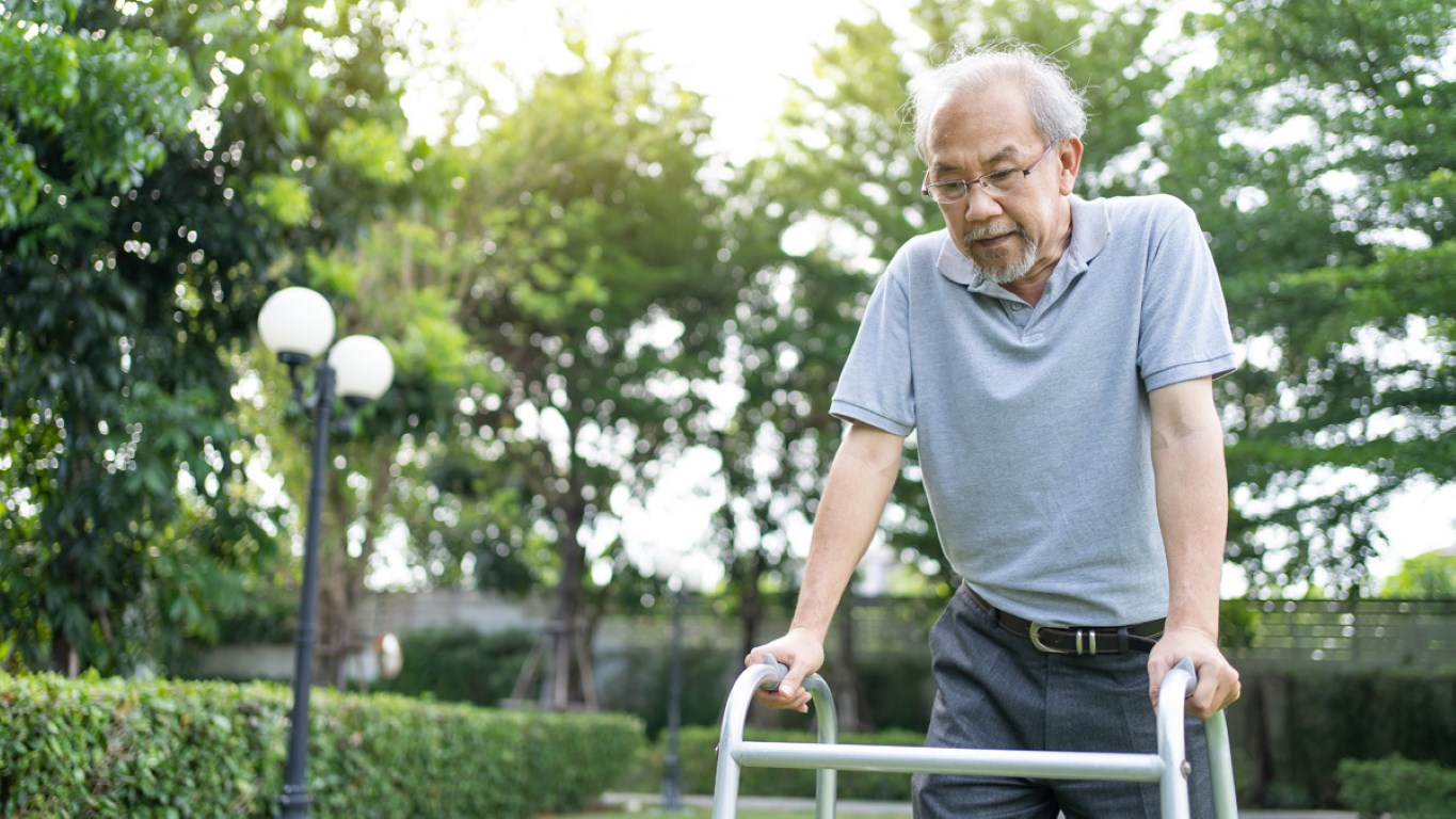 asian senior disabled man walking slowly with walk 2021 12 09 12 52 14 utc