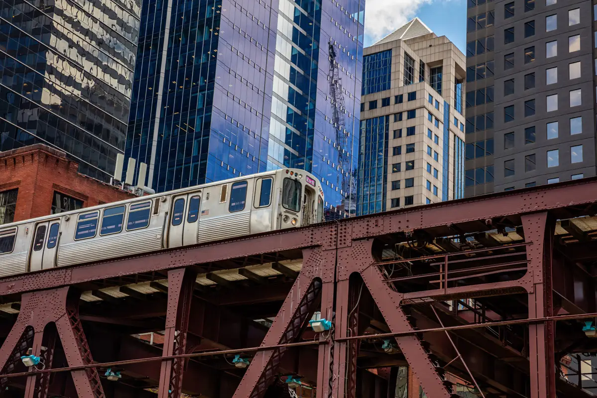 chicago train on a bridge skyscrapers