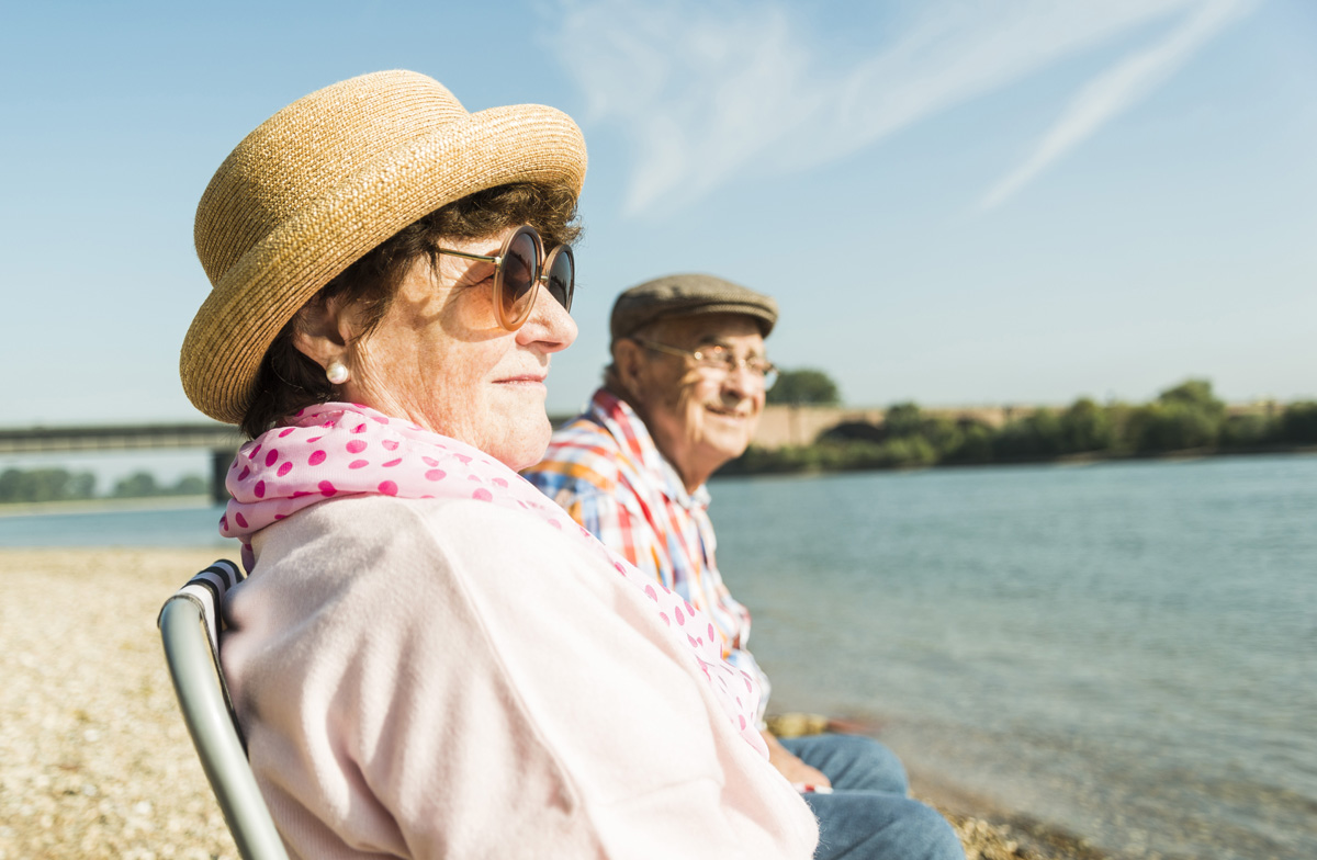 couple sitting on chairs savannah river