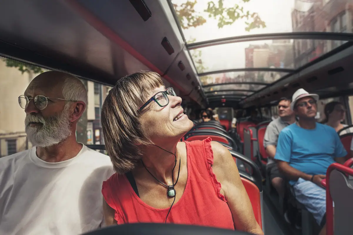 mature couple travelling in bus