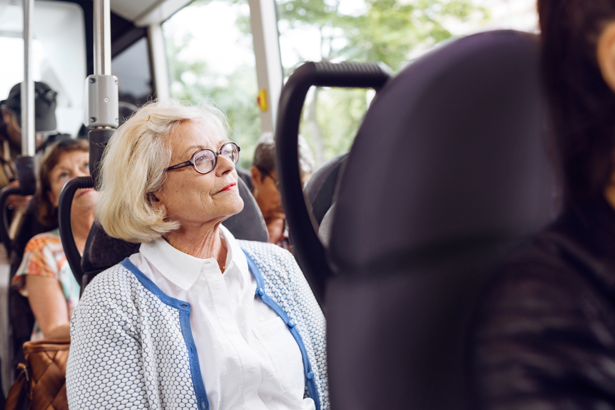 senior woman sitting in bus in montgomery
