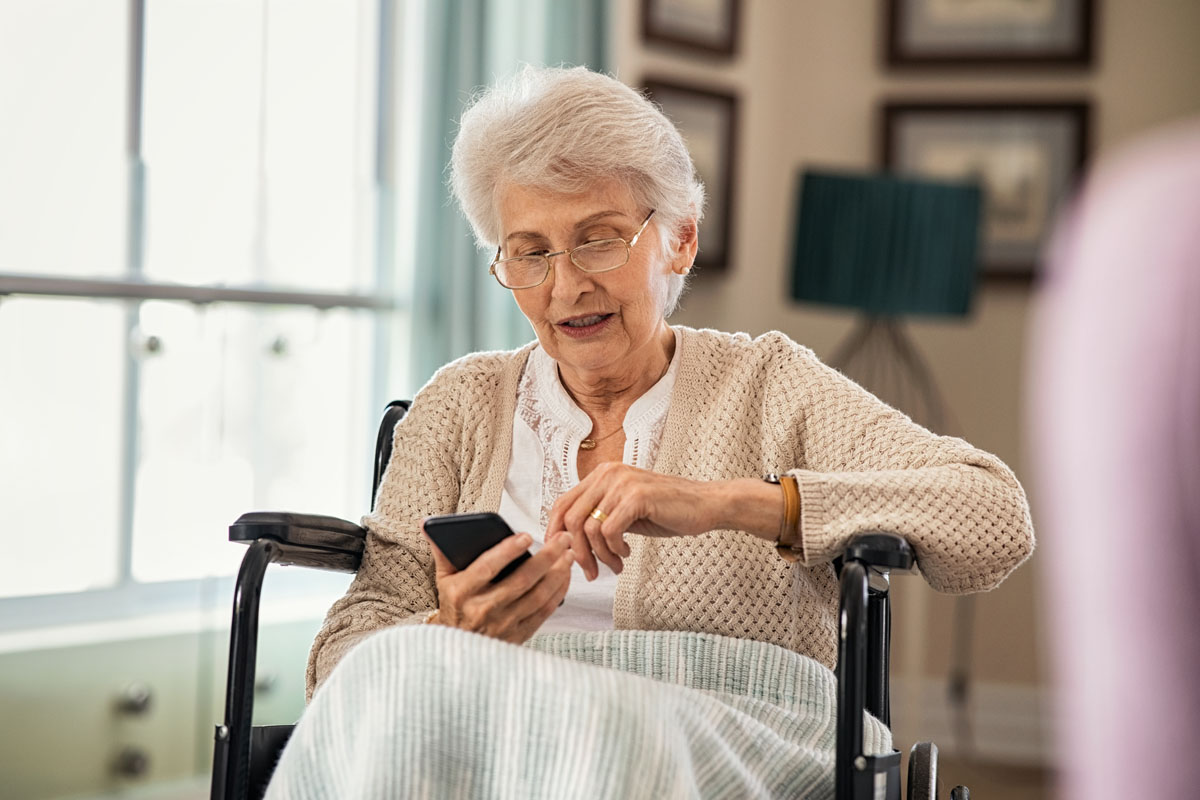 senior woman using phone find apartment