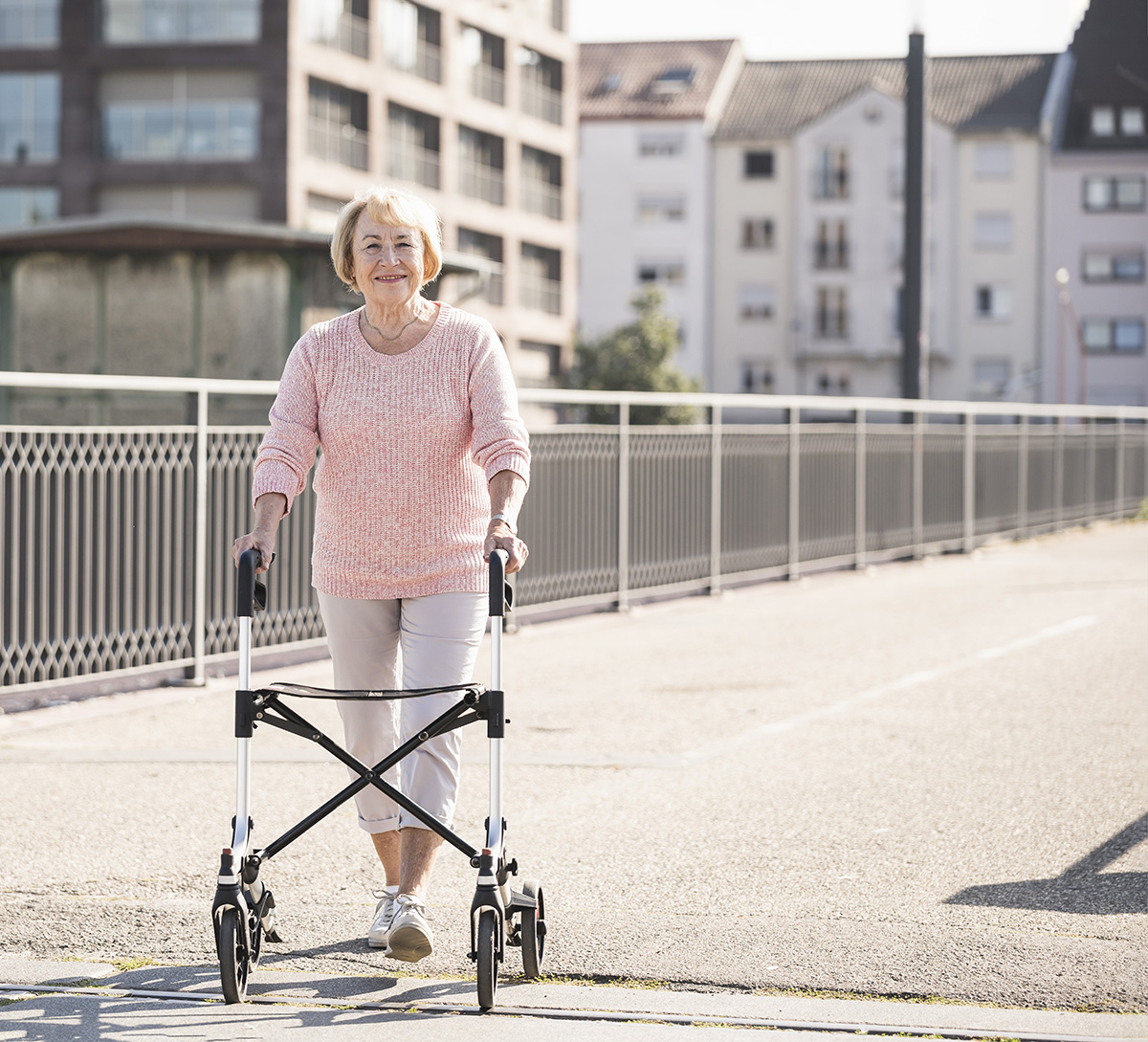senior woman with wheeled walker on footbridge 2022 03 08 01 31 08 utc
